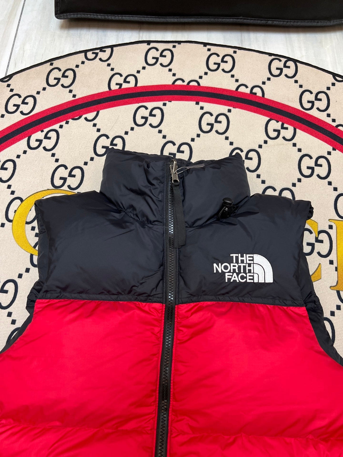 The North Face Puffer Vest in Red and Black with Stand Collar